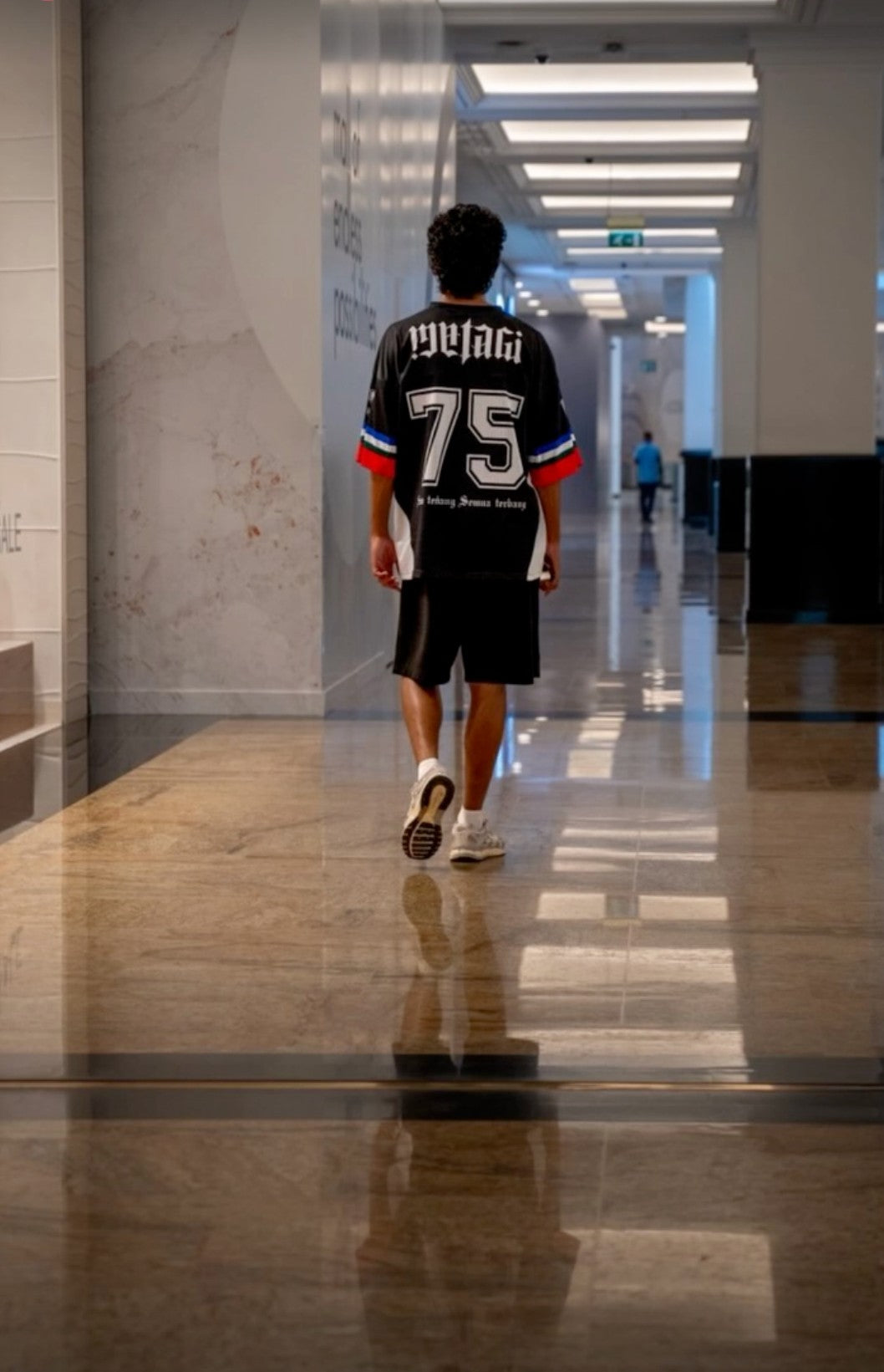 MATAGI jersey worn in an editorial corridor setting